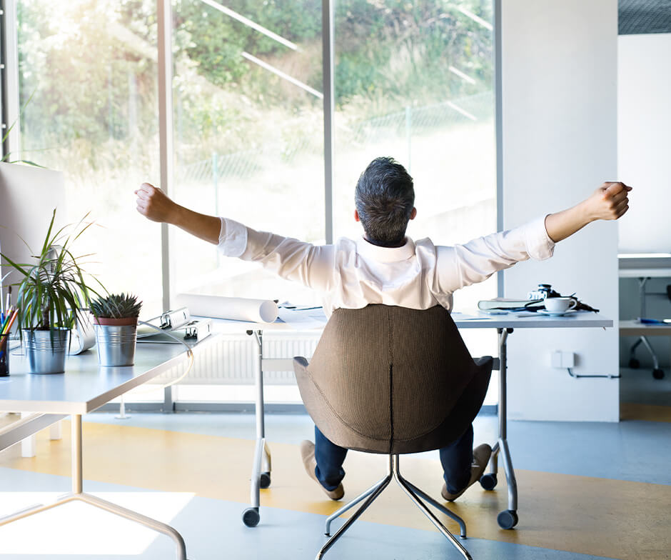 a man yawning in a office