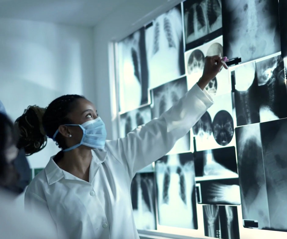 healthcare worker looking at xrays