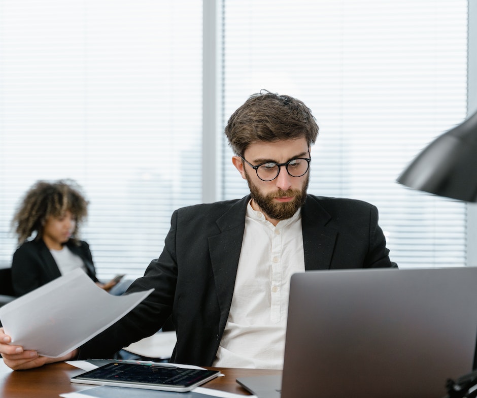 person reviewing documents at their desk