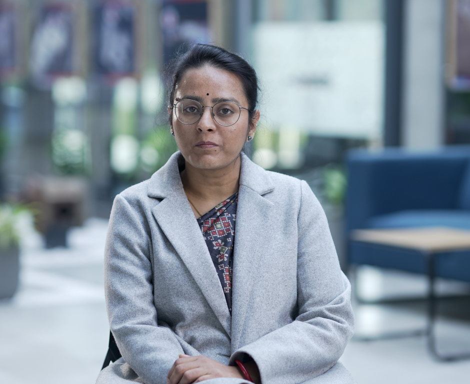 person sitting with arms crossed